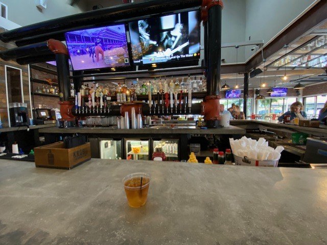The Local bar interior with craft beer taps and TVs in North Myrtle Beach