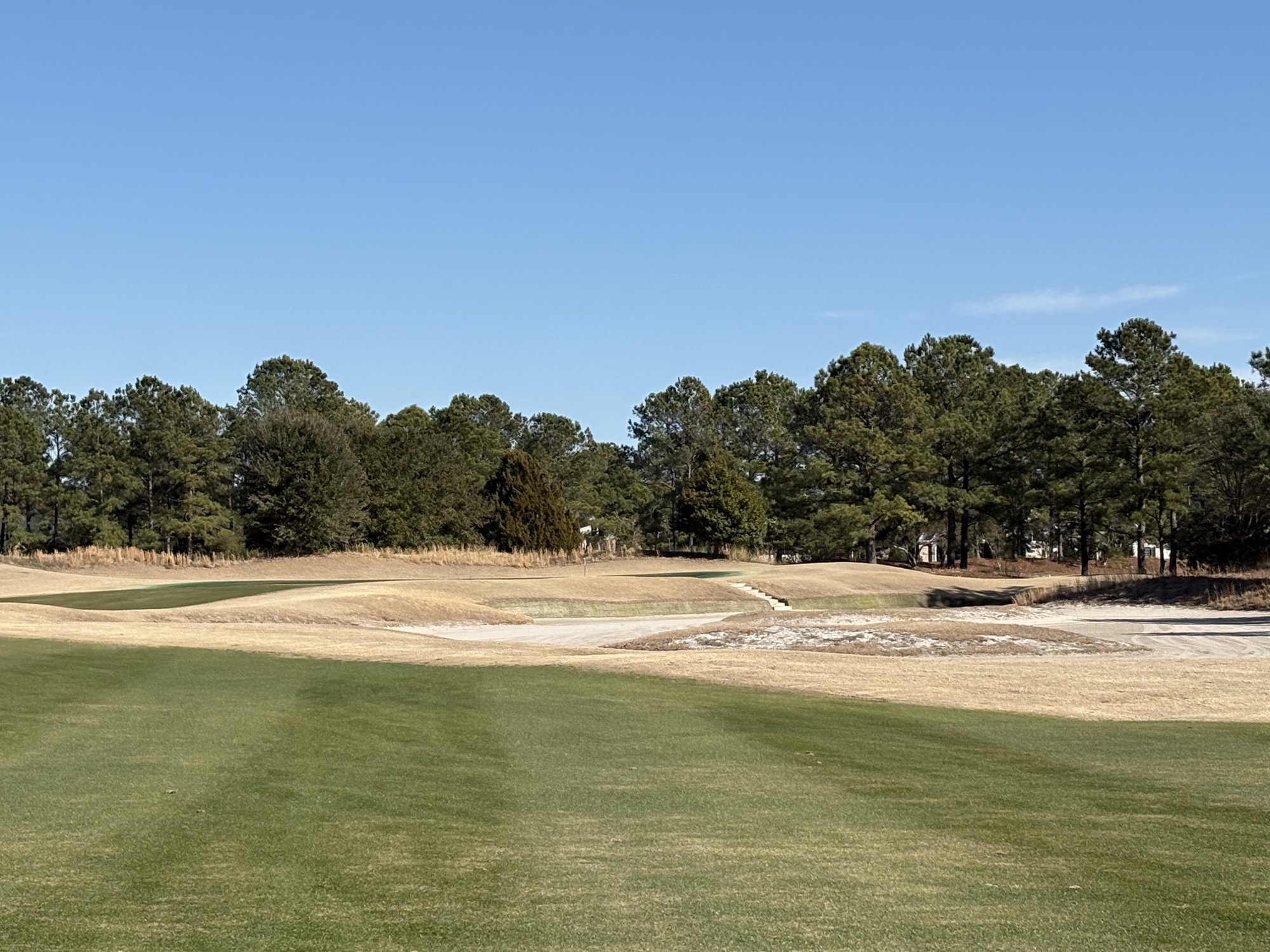 Stewart nine fairway with waste bunkers and pine trees at Thistle Golf Club Sunset Beach NC