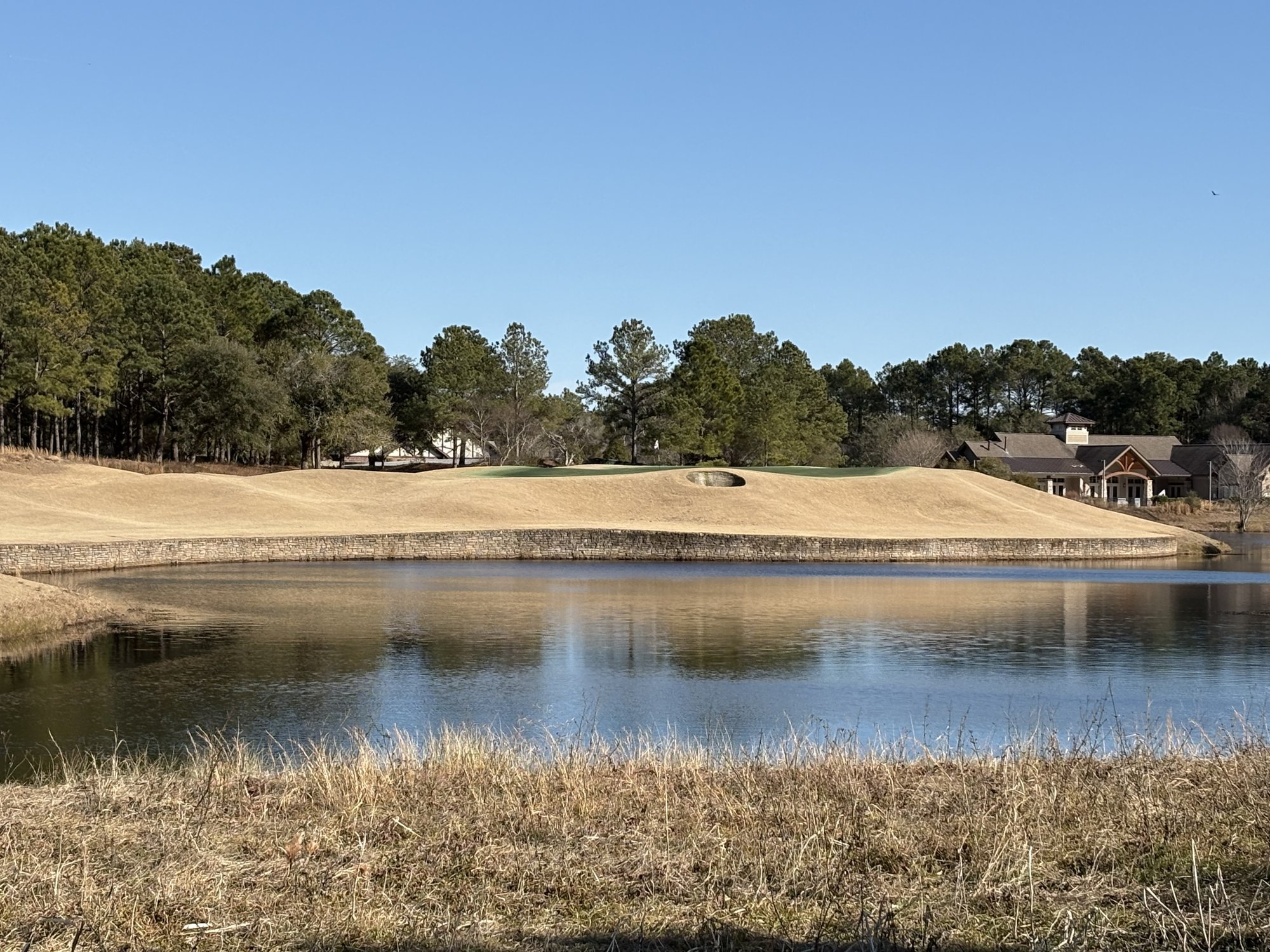Stewart nine island-style green over water at Thistle Golf Club Sunset Beach NC