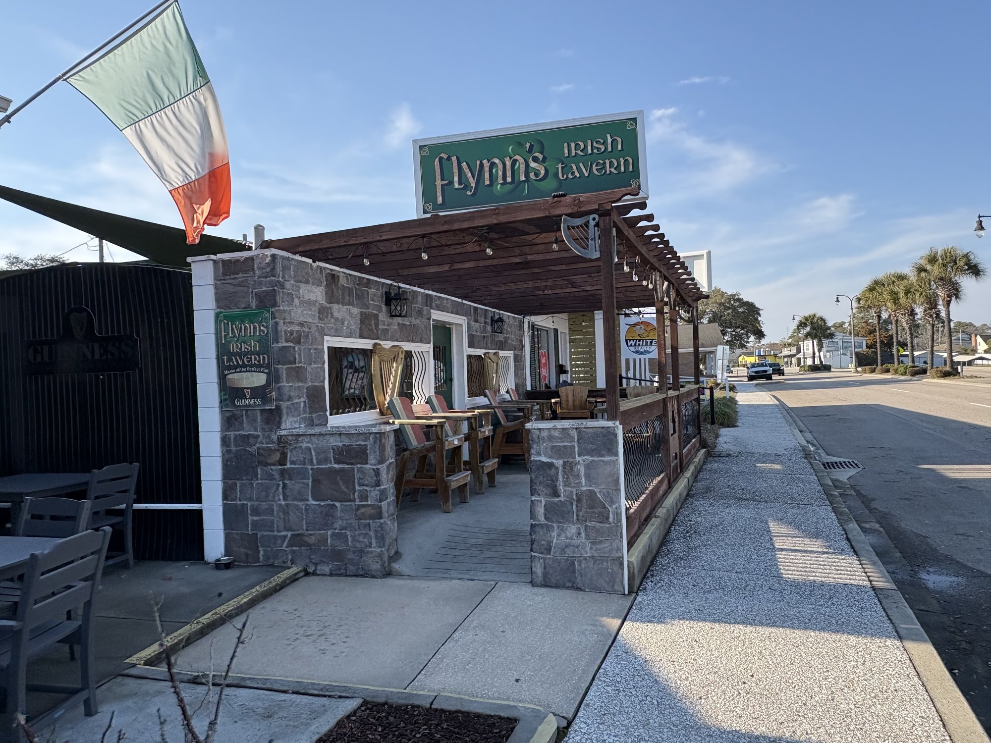 Flynn's Irish Tavern patio with Irish flag on Main Street North Myrtle Beach