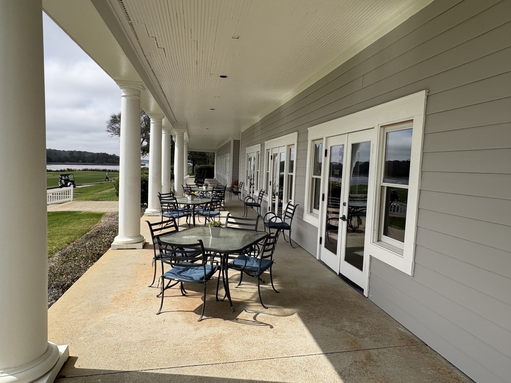 Glen Dornoch clubhouse veranda with columns overlooking golf course and Intracoastal Waterway