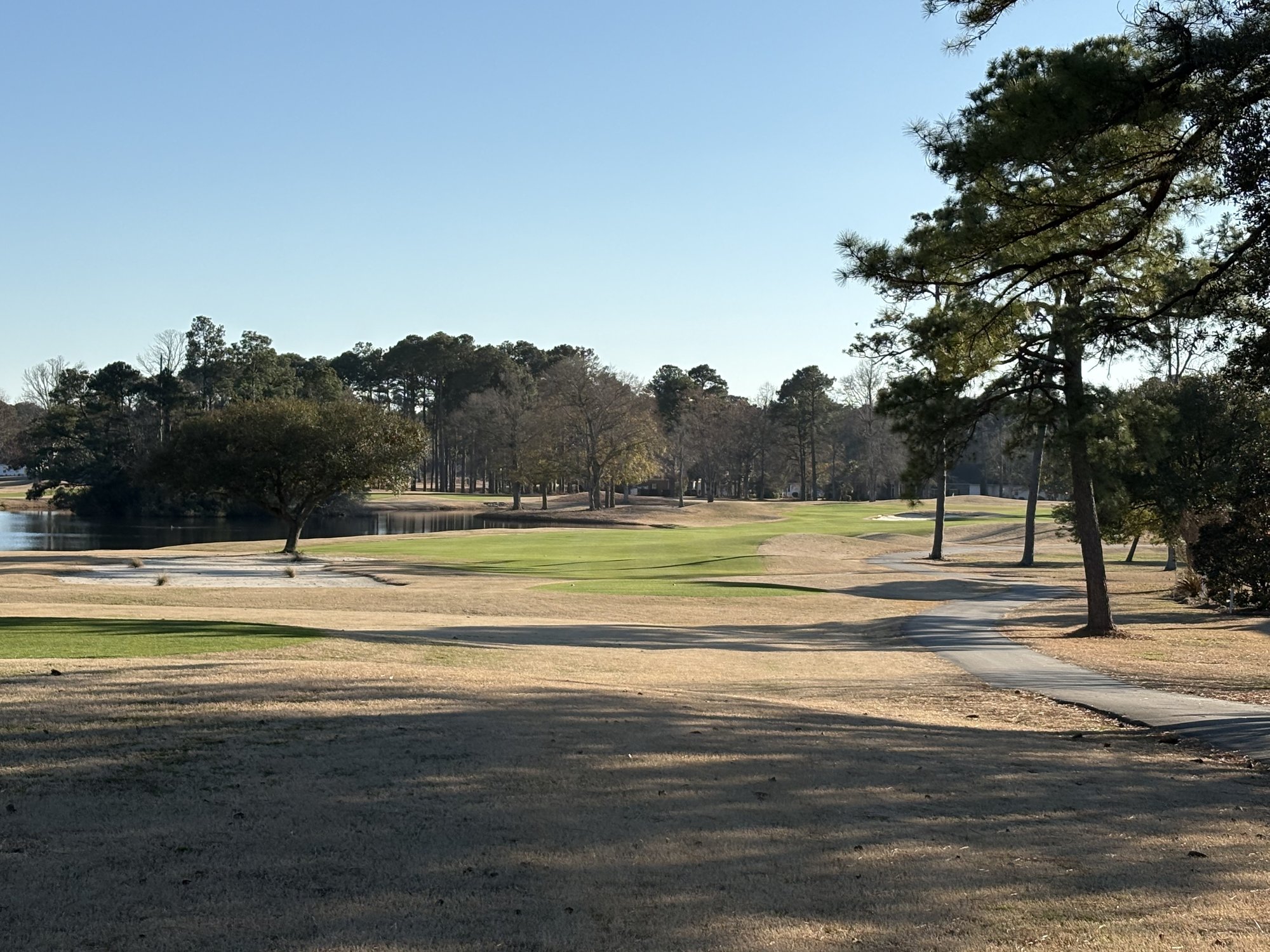Fairway with water hazard trees and bunkers on Sea Trail Byrd Course Sunset Beach NC